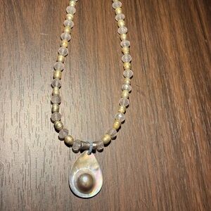 Elegant Beaded Necklace with Shell Pendant